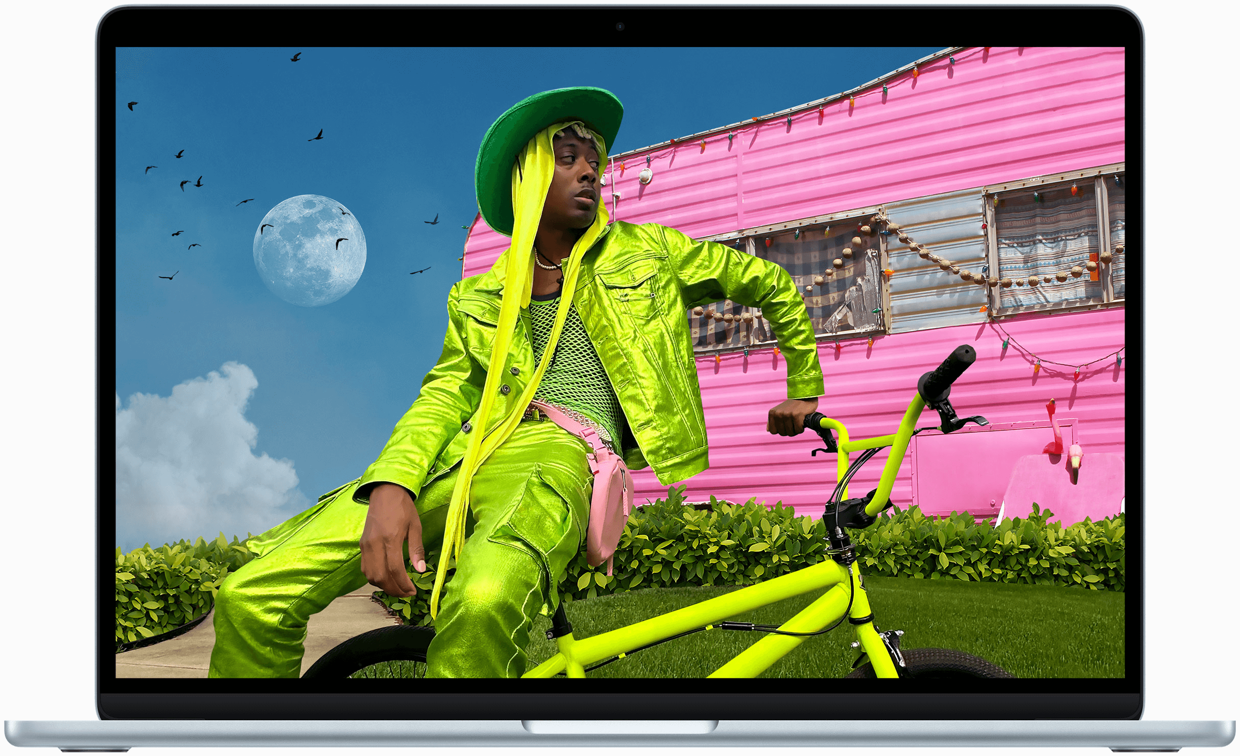 MacBook Air screen showing photo of person in colorful outfit, demonstrating color range and resolution of Liquid Retina display.